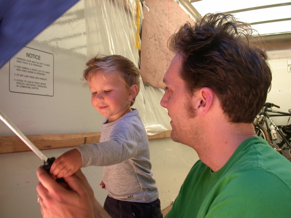 Kalen and Tim discovering the wonders of the umbrella.