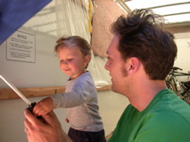 Kalen and Tim discovering the wonders of the umbrella.